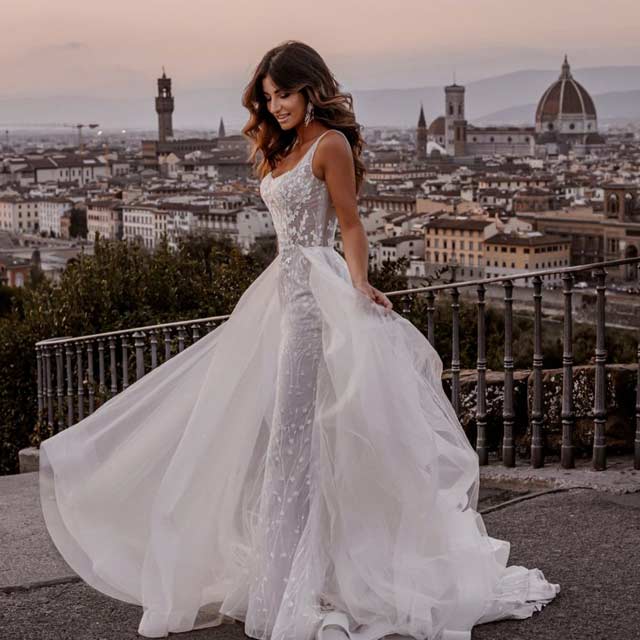 A bride wearing an Abella wedding dress